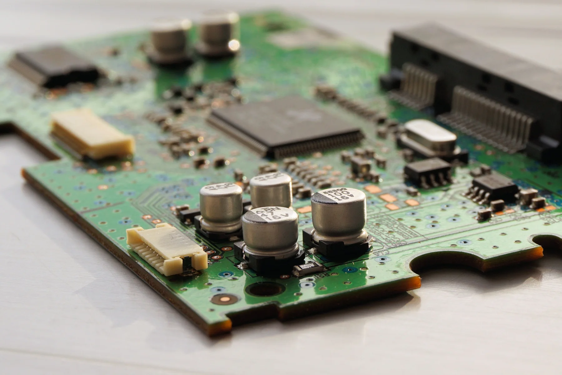Close view of capacitors and components mounted on a printed circuit board